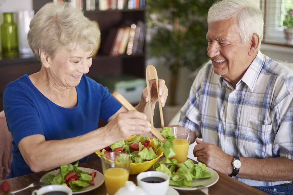 Healthy breakfast eaten by senior couple